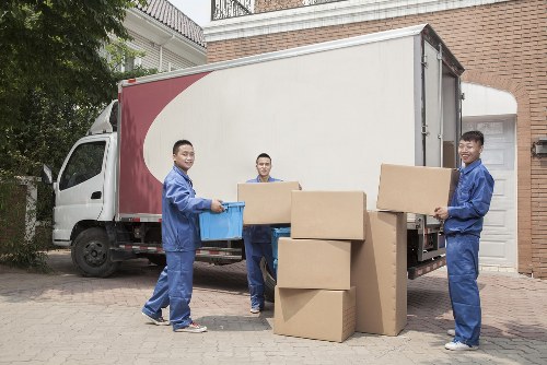 Removal team preparing a Dulwich home move with boxes and furniture