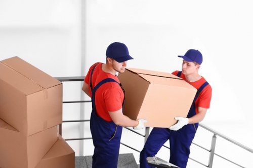 Piano removal team preparing an instrument for safe loading and transport