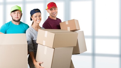 Flat removal service unloading household items at a Dulwich property
