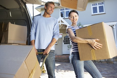 Packed moving boxes and furniture ready for house removals